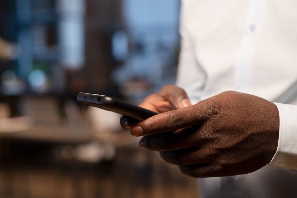 man using smartphone for online business