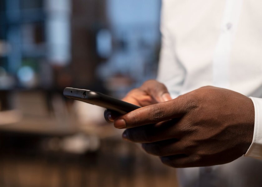 man using smartphone for online business