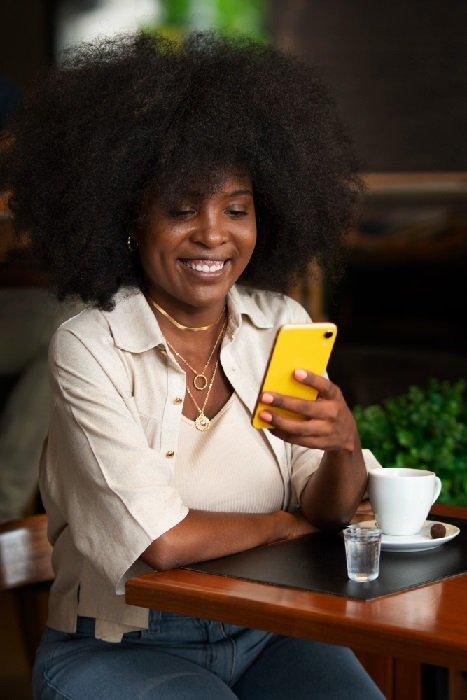A woman utilizing her phone in an online business