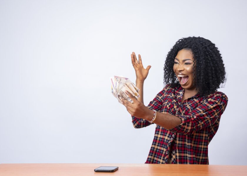 beautiful-black-woman-holding-looking-money-her-hand